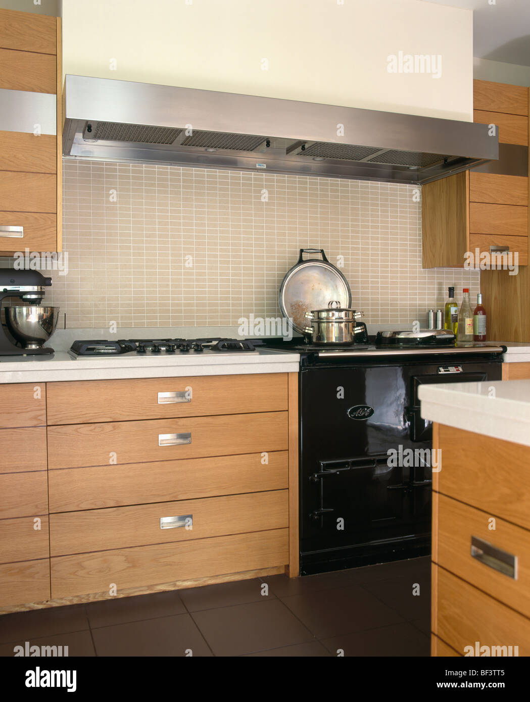 Rectangular Stainless Steel Extractor And Tiled Splash back Above Black Rectangular Stainless Steel Extractor And Tiled Splash back Above Black
