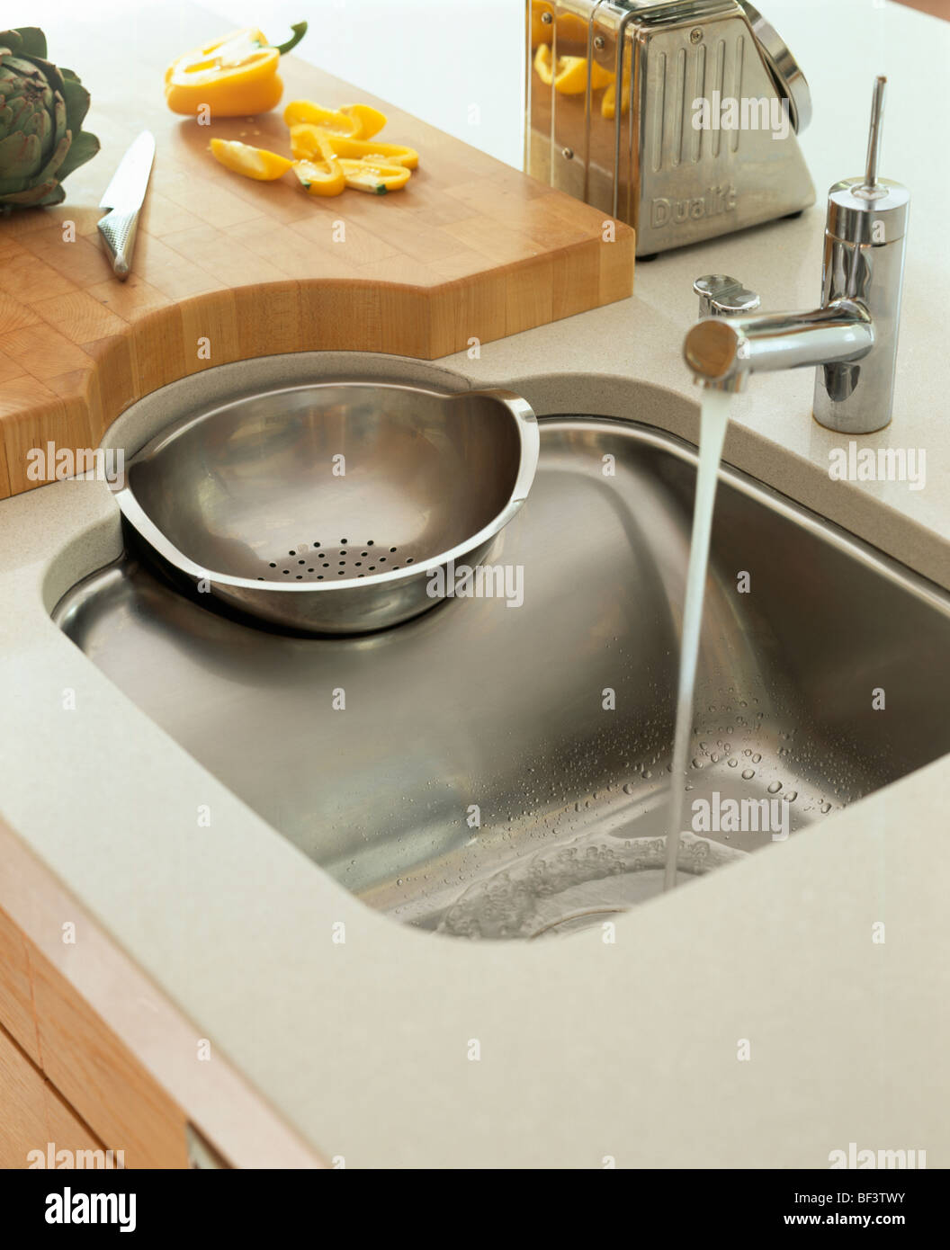 Close-up of Philippe Starck stainless steel sink and drainer with Franke tap  Stock Photo - Alamy