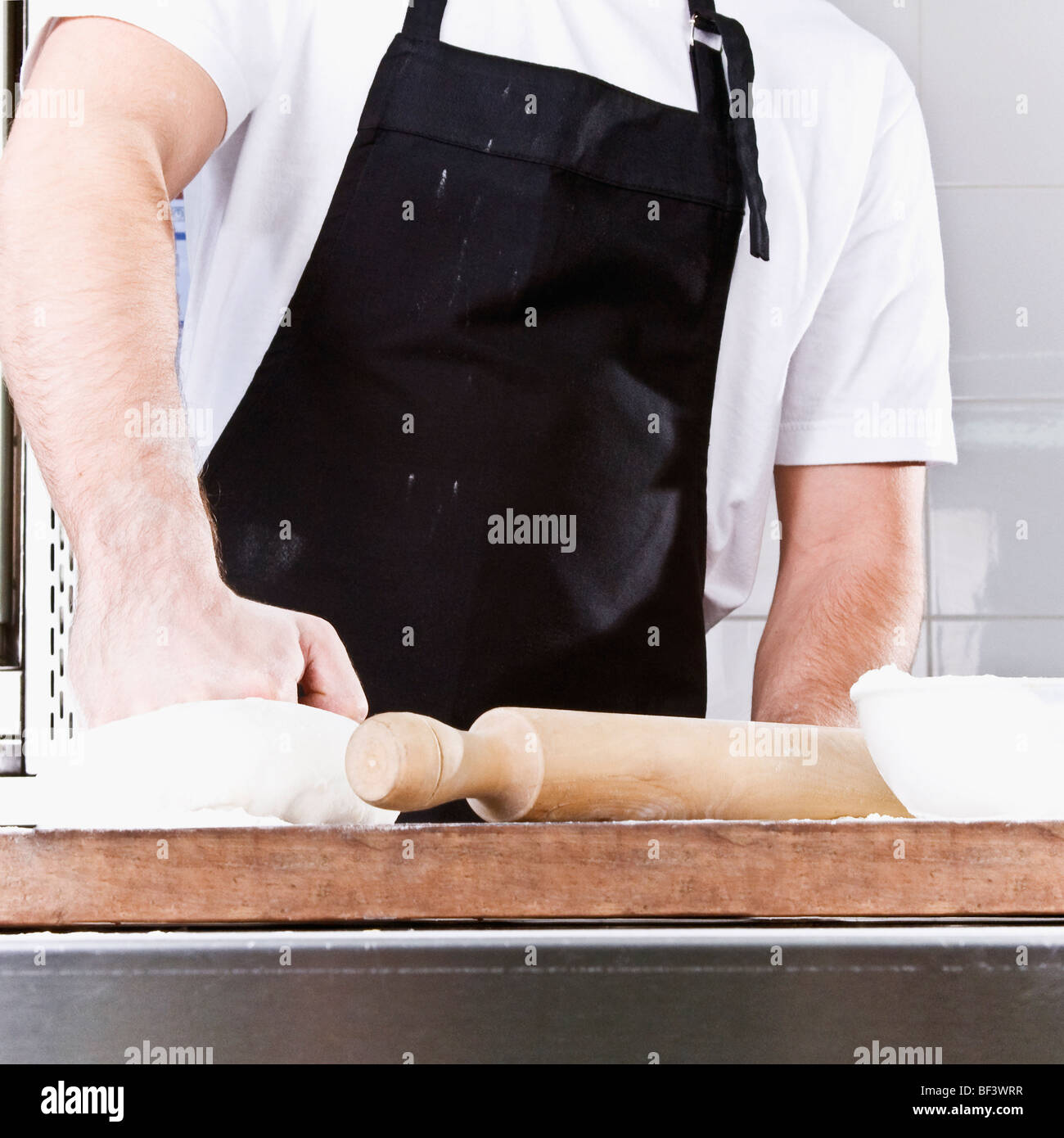 Chef kneading pizza dough Stock Photo - Alamy