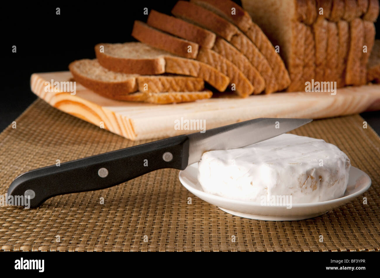 Close-up of Brie served with bread Stock Photo