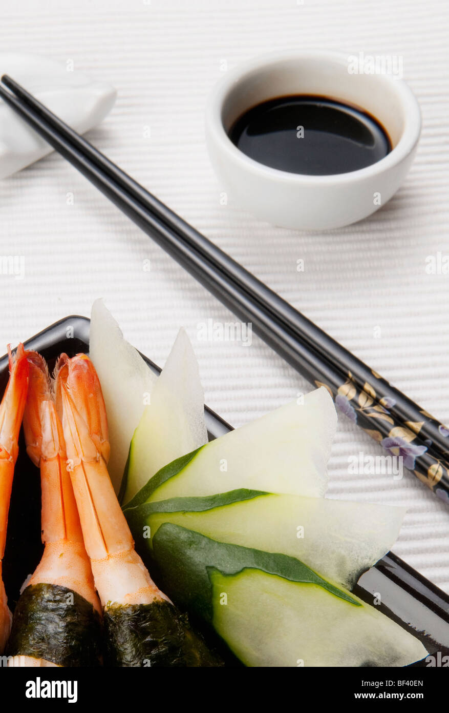 Close up of nigiri sushi with chopsticks bowl of soy sauce hires stock photography and images