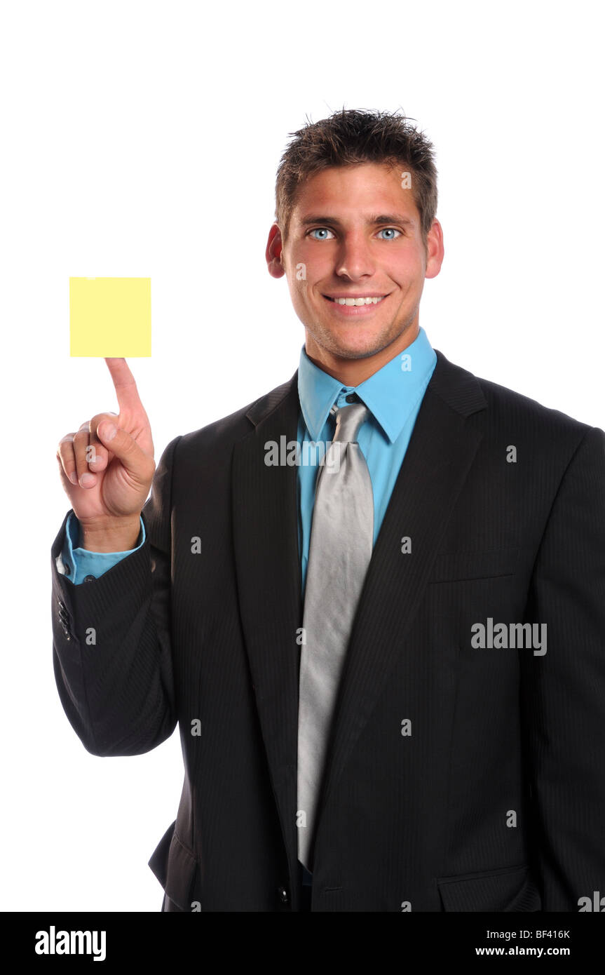 Businessman holding adhesive note isolated over white background Stock Photo