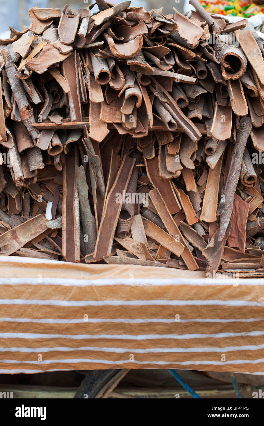 Pile of  Cinnamon on a cart at an Indian market Stock Photo