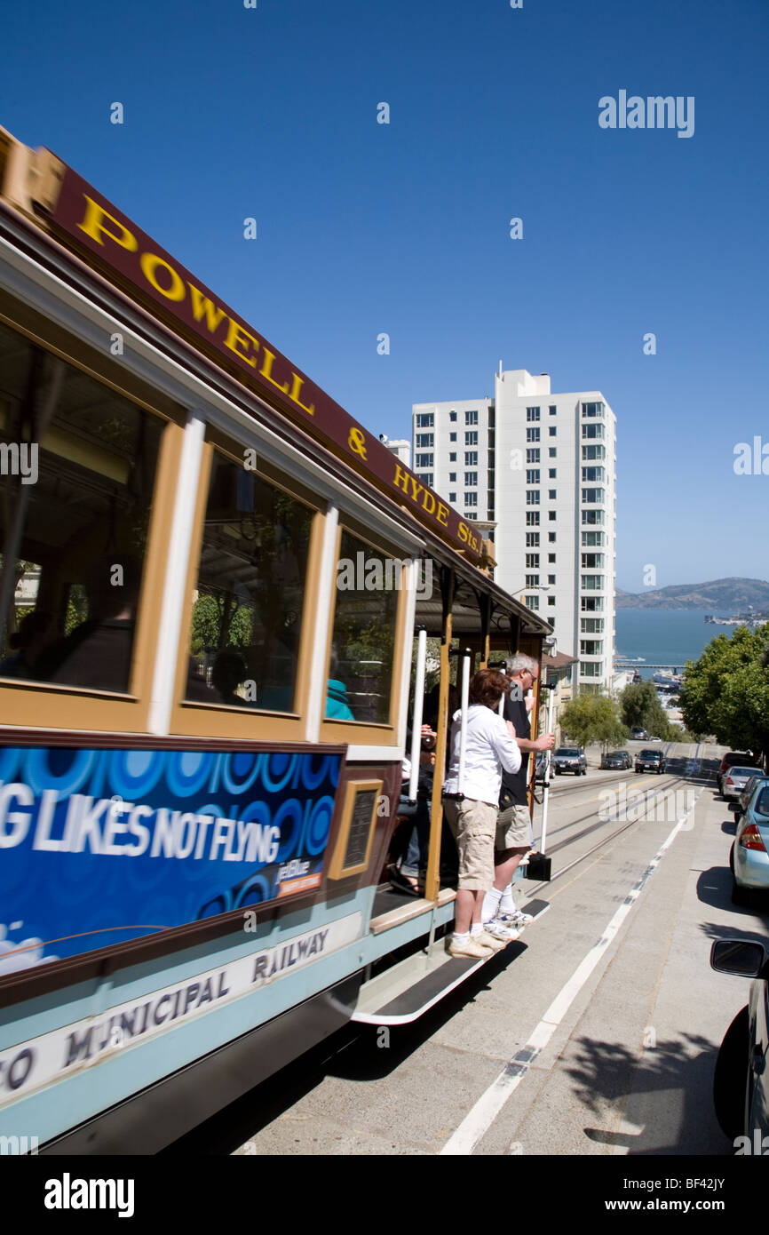 Cable car descending Hyde Street towards Alcatraz, San Francisco California Stock Photo