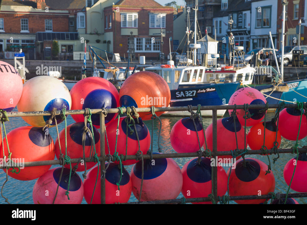 "fishing boats" and buoys Weymouth Harbour Dorset England Stock Photo
