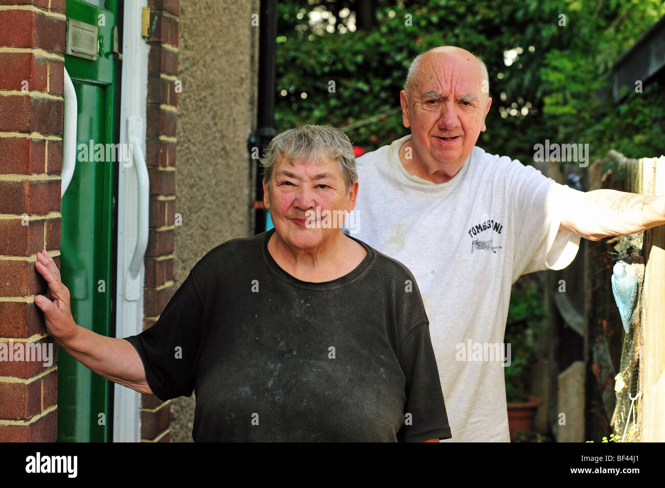 Portrait of a elderly couple standing outside their home Stock Photo ...