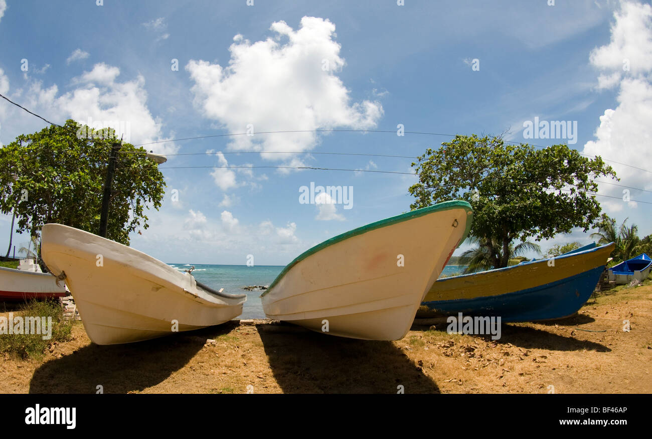 native fishing boats on shore of caribbean sea big corn island