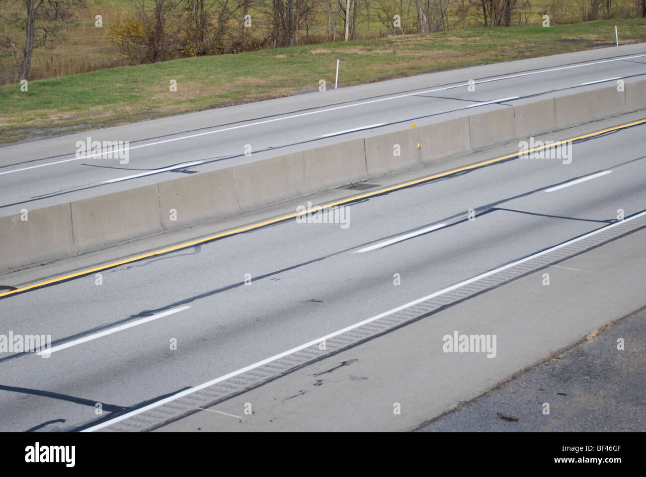 Empty road, an American four lane interstate highway, the Pennsylvania Turnpike. Stock Photo