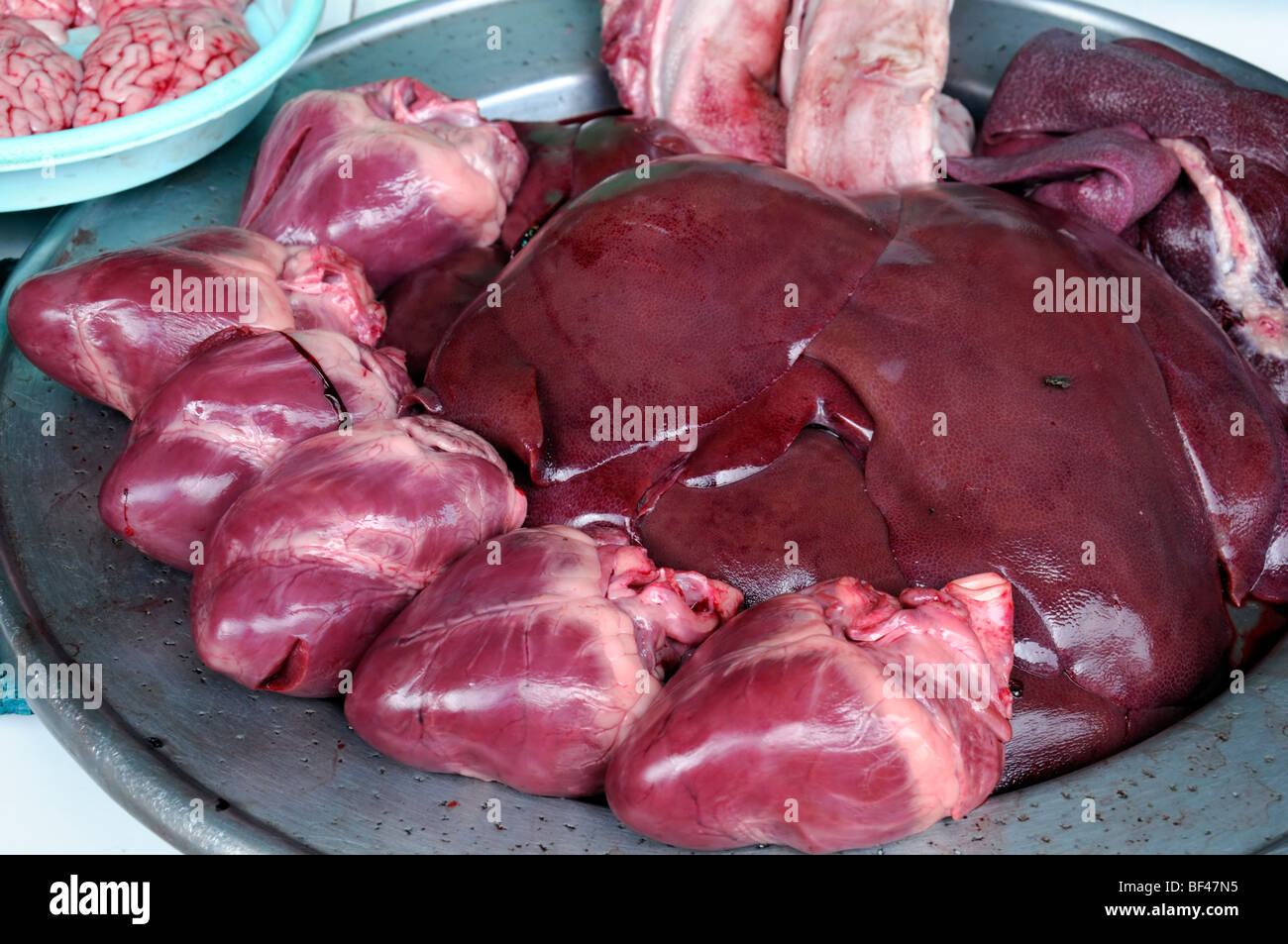 meat products offal organ organs heart liver produce food on sale market ho chi minh vietnam asia unsanitary Ben Thanh Market Stock Photo