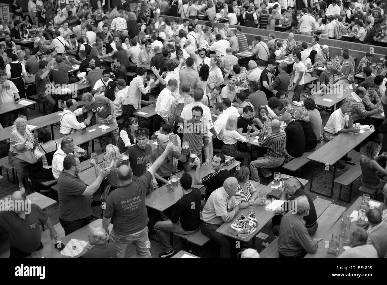 Drinkers in a beer hall at the Oktoberfest beer festival in Munich in southern Germany Stock Photo