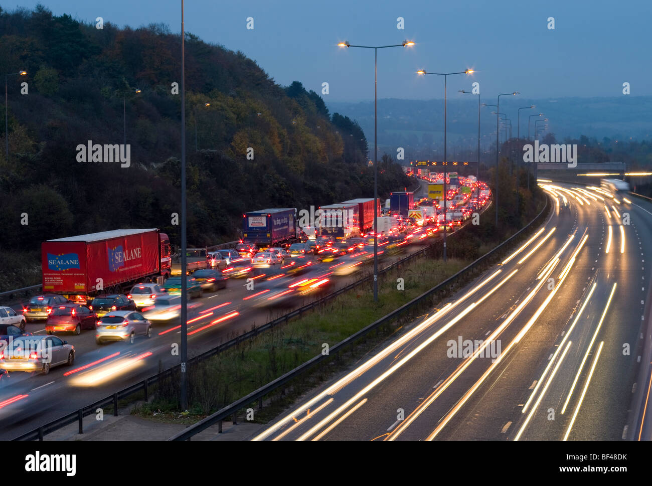 Evening Traffic Jams On The M25 motorway With Traffic Trails Stock Photo