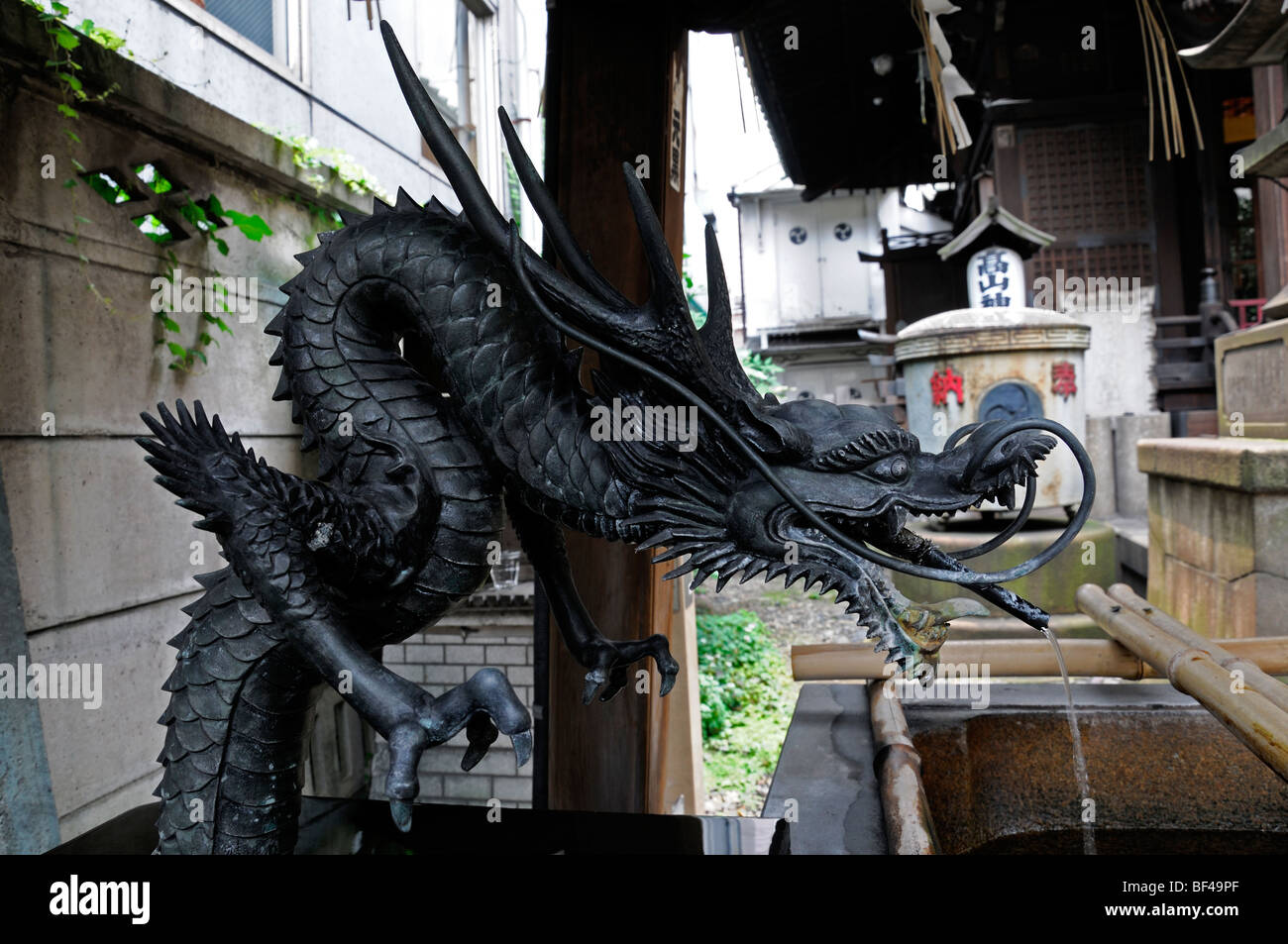 An intricately carved and detailed dragon shaped water fountain with in