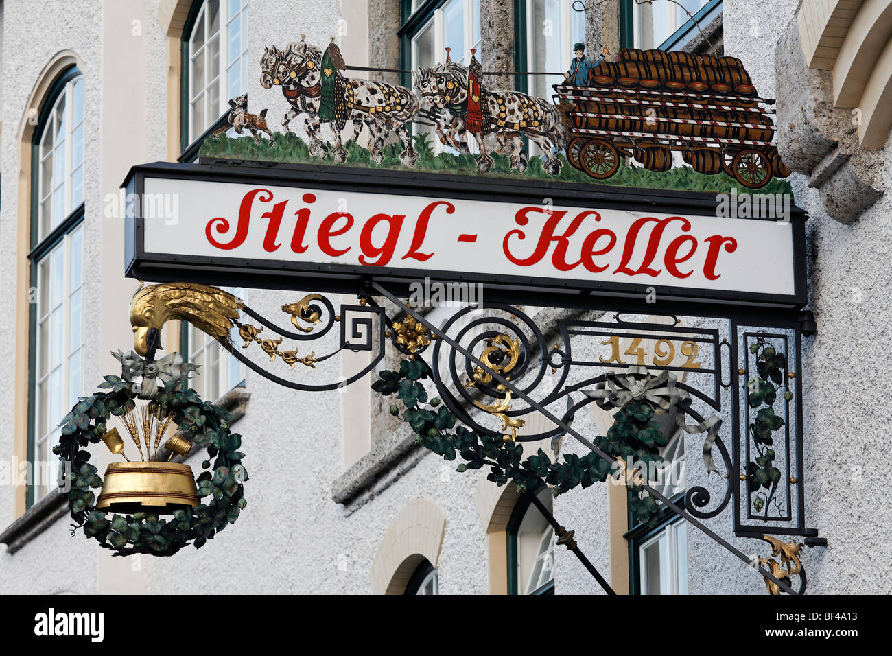 Wrought iron pub sign with beer coach, traditional restaurant Stieglkeller, Salzburg, Austria, Europe Stock Photo