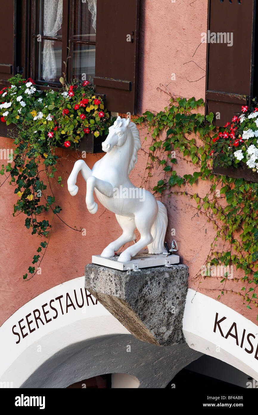 House sign of the famous hotel Im Weissen Roessl, St. Wolfgang on the Wolfgangsee lake, Salzkammergut region, Upper Austria, Au Stock Photo