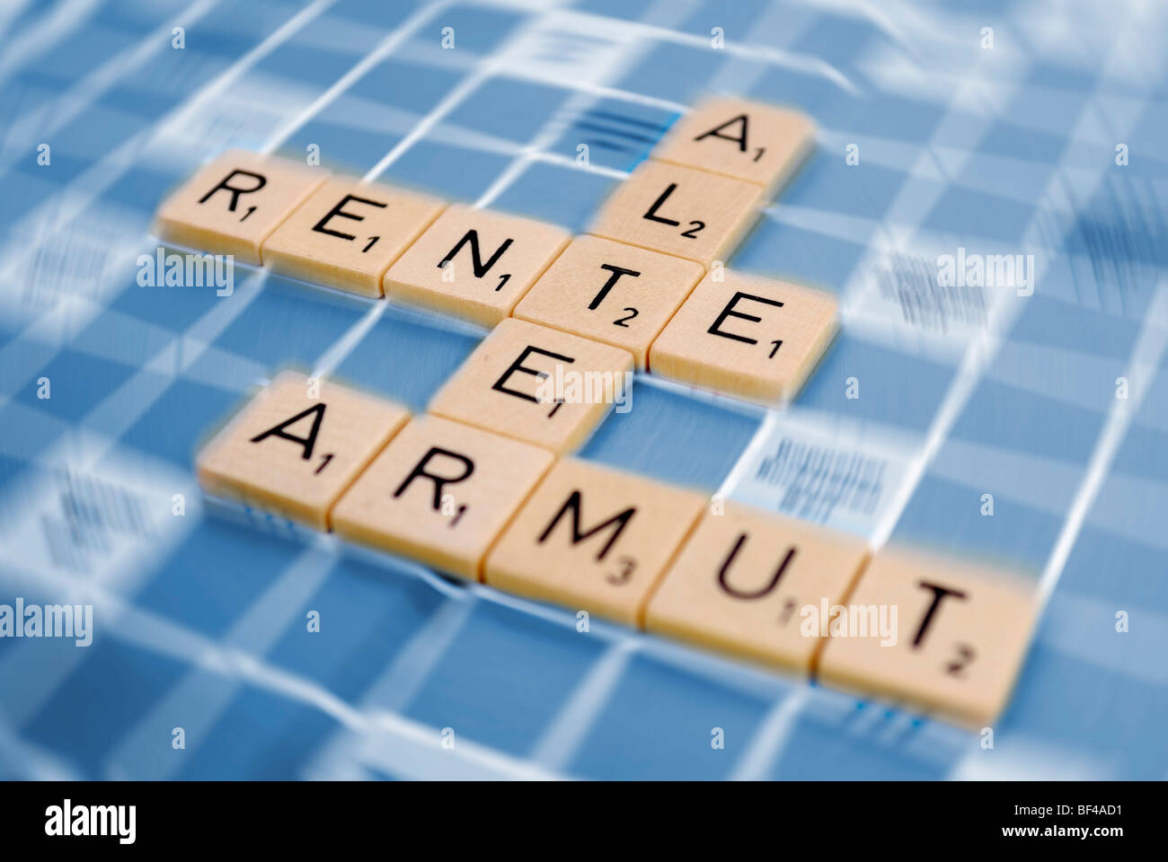 The words 'Alter', 'Rente ' and 'Armut ', German for 'age', 'pension' and 'poverty', composed of tiles, symbolic image for old- Stock Photo