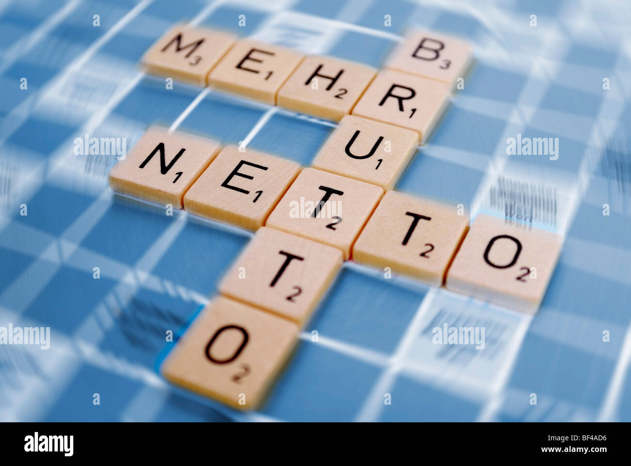The words 'Brutto', 'mehr ' and 'Netto', German for 'more netto from brutto', composed of tiles, symbolic image for tax cut, pa Stock Photo