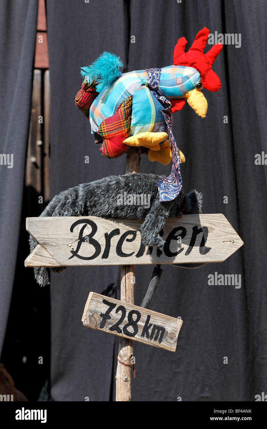 Handwritten sign post to Bremen with a fabric rooster, puppet-show of ...