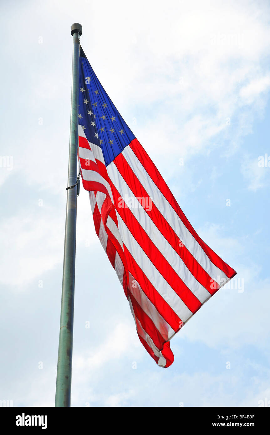 American flag against blue sky Stock Photo - Alamy