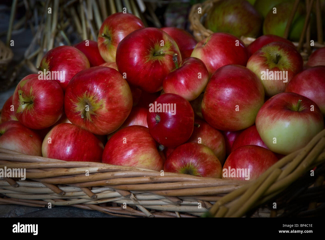 Apples in a wicker basket on display at a harvest festival. England GB. Stock Photo