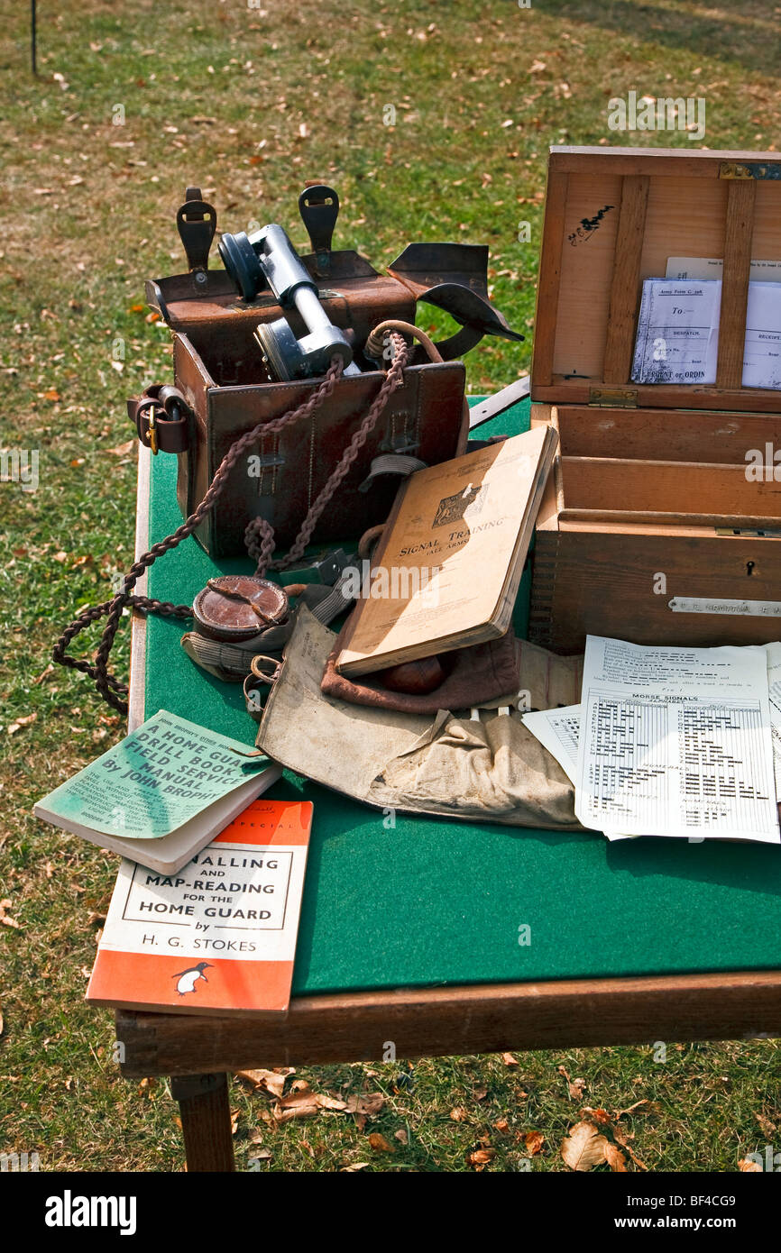 Home Guard war memorabilia displaying a field phone and signal manuals on a table at Goodwood west Sussex, Engand, UK 2009 Stock Photo