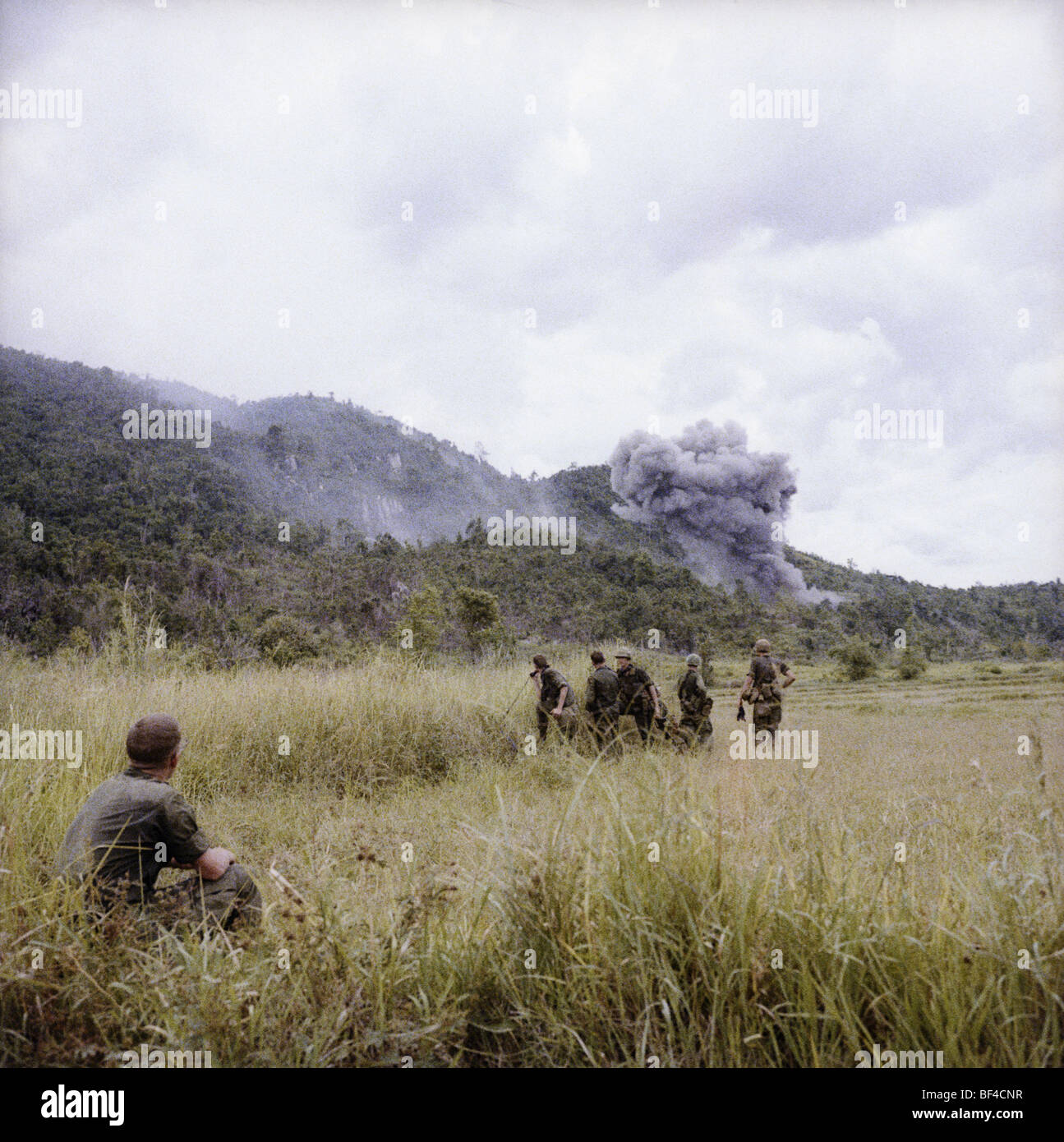 The Blues light infantry watches as a strike hit its target. B Troop, 1st Squadron, 9th Cavalry during the Vietnam War in 1967. Stock Photo