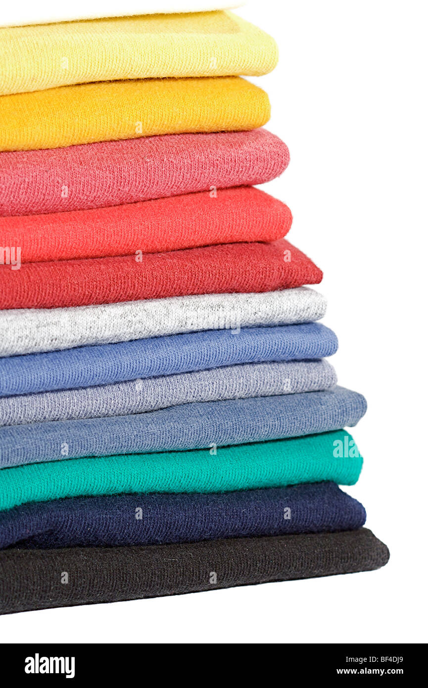 Neat stack of colored tee shirts for sale in a retail shop Stock Photo ...