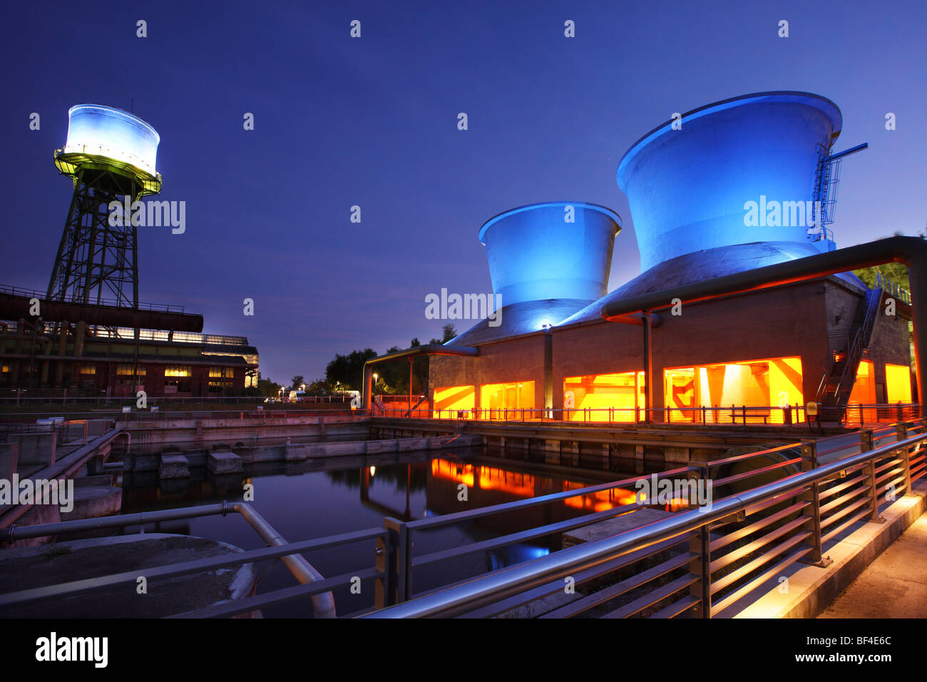 Westpark, illuminated cooling tower, at Jahrhunderthalle, concert hall former steelworks, industrial heritage site, Bochum Stock Photo