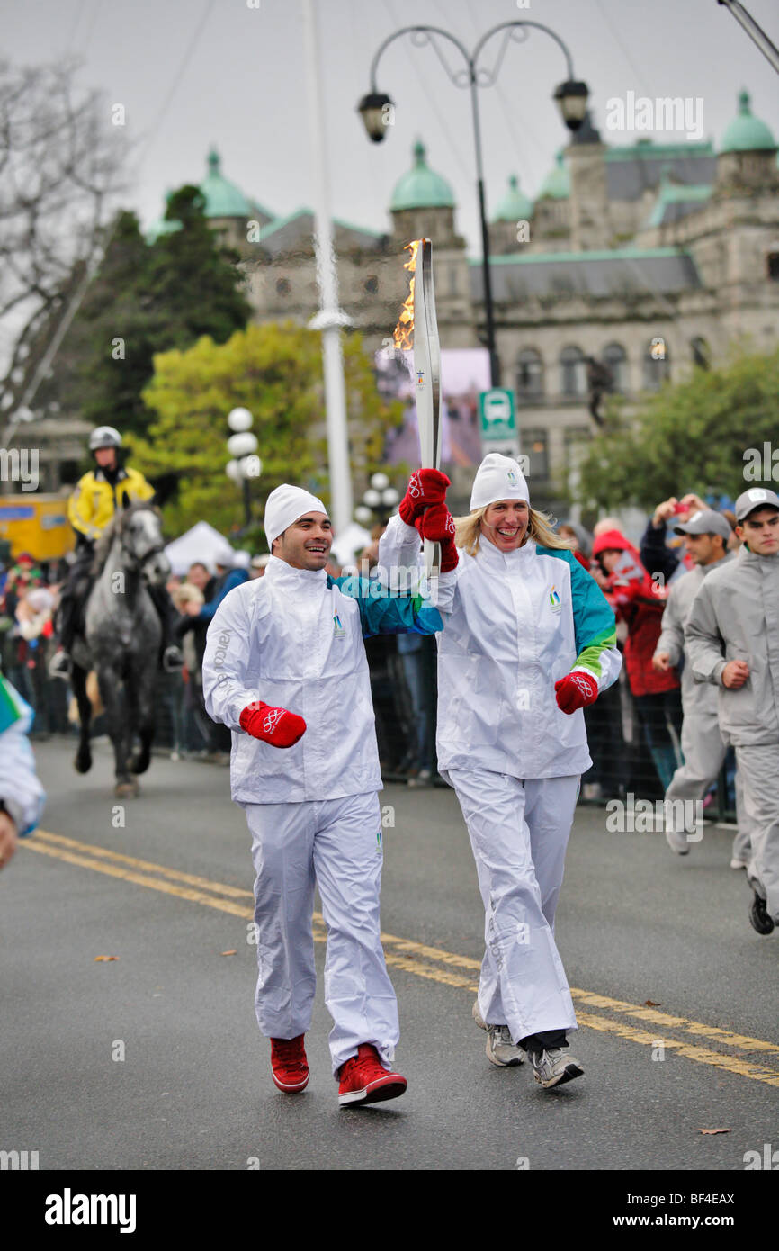 Second  team carrying 2010 Winter Olympic torch-Victoria, British Columbia, Canada. Stock Photo