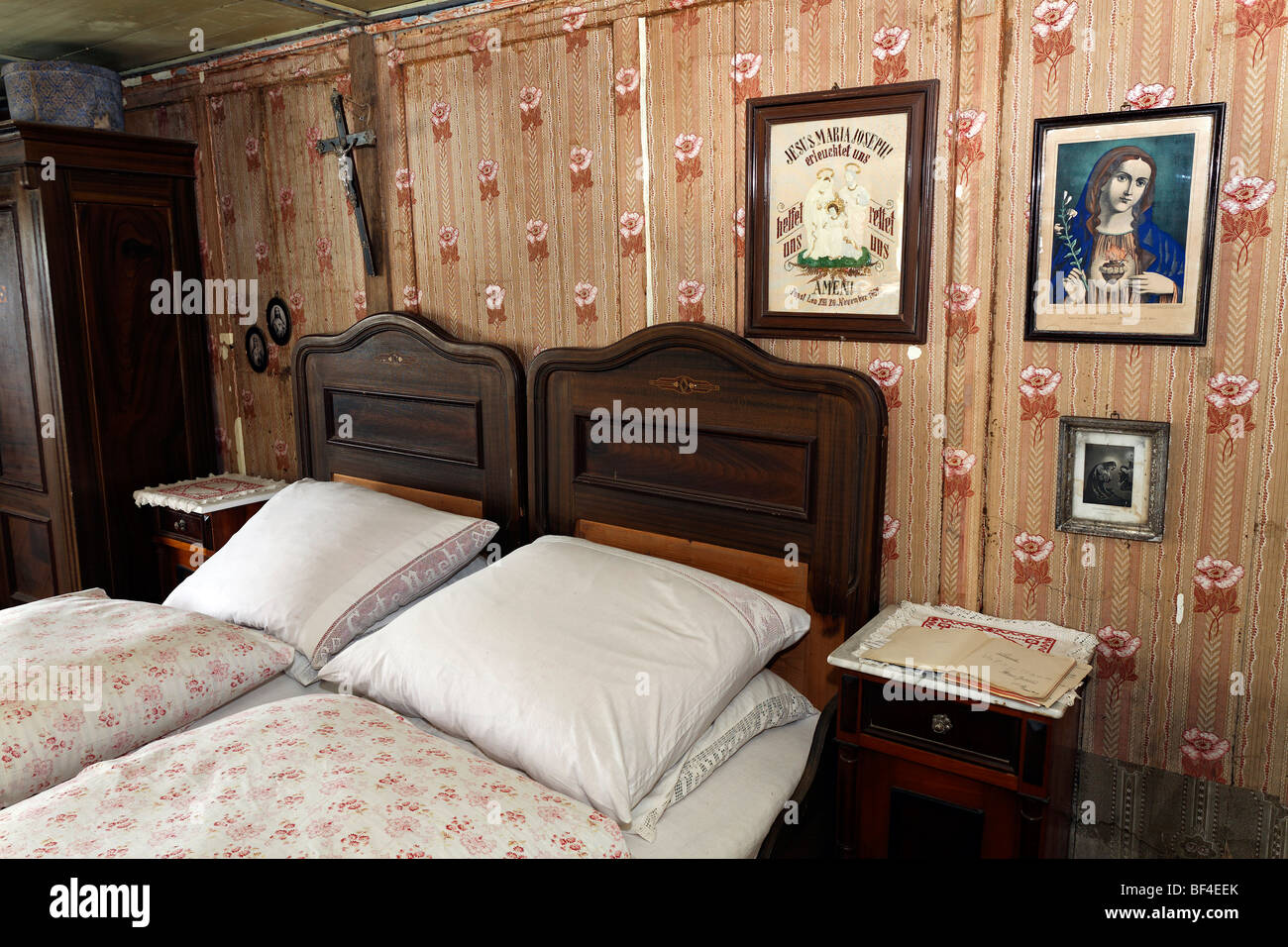 Farmer's bedroom with double bed, pictures of saints on the wall, Haus
