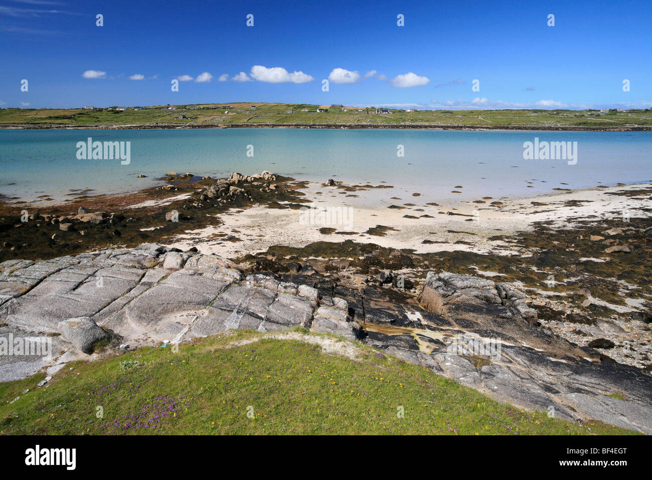 beach on Omey Island at low tide, Ireland; view to Claddaghduff Stock Photo