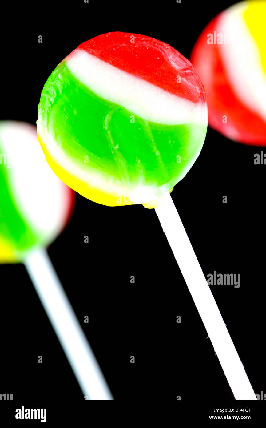 Lolly pops isolated against a black background Stock Photo