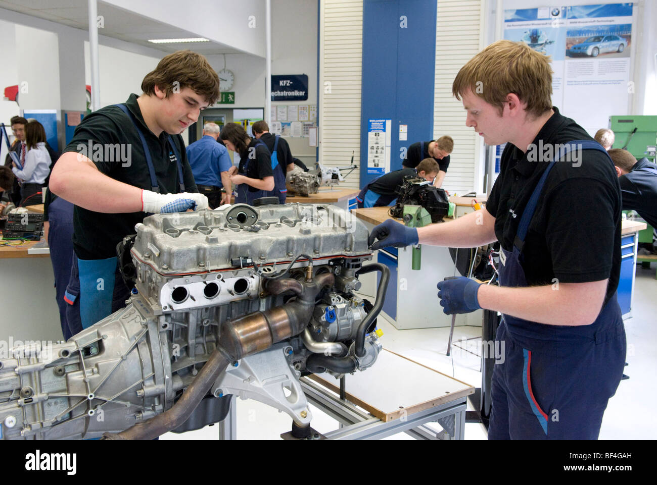 Apprentices working on an engine in the BMW training center for