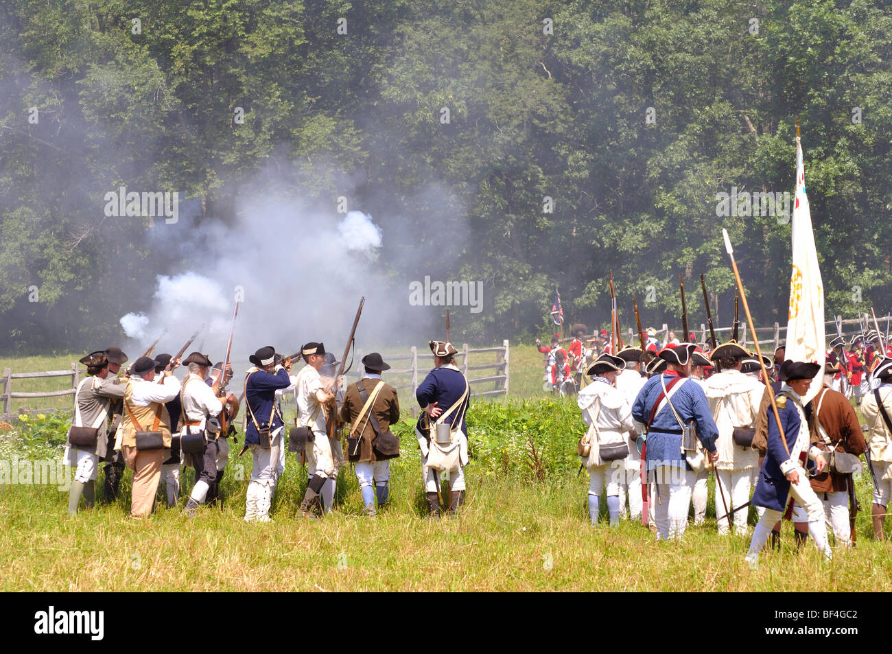 American patriots in battle costumed American Revolutionary War (1770's) era reenactment