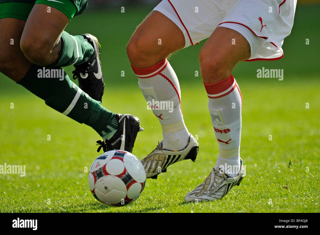 Detail, footballers' legs, duel Stock Photo