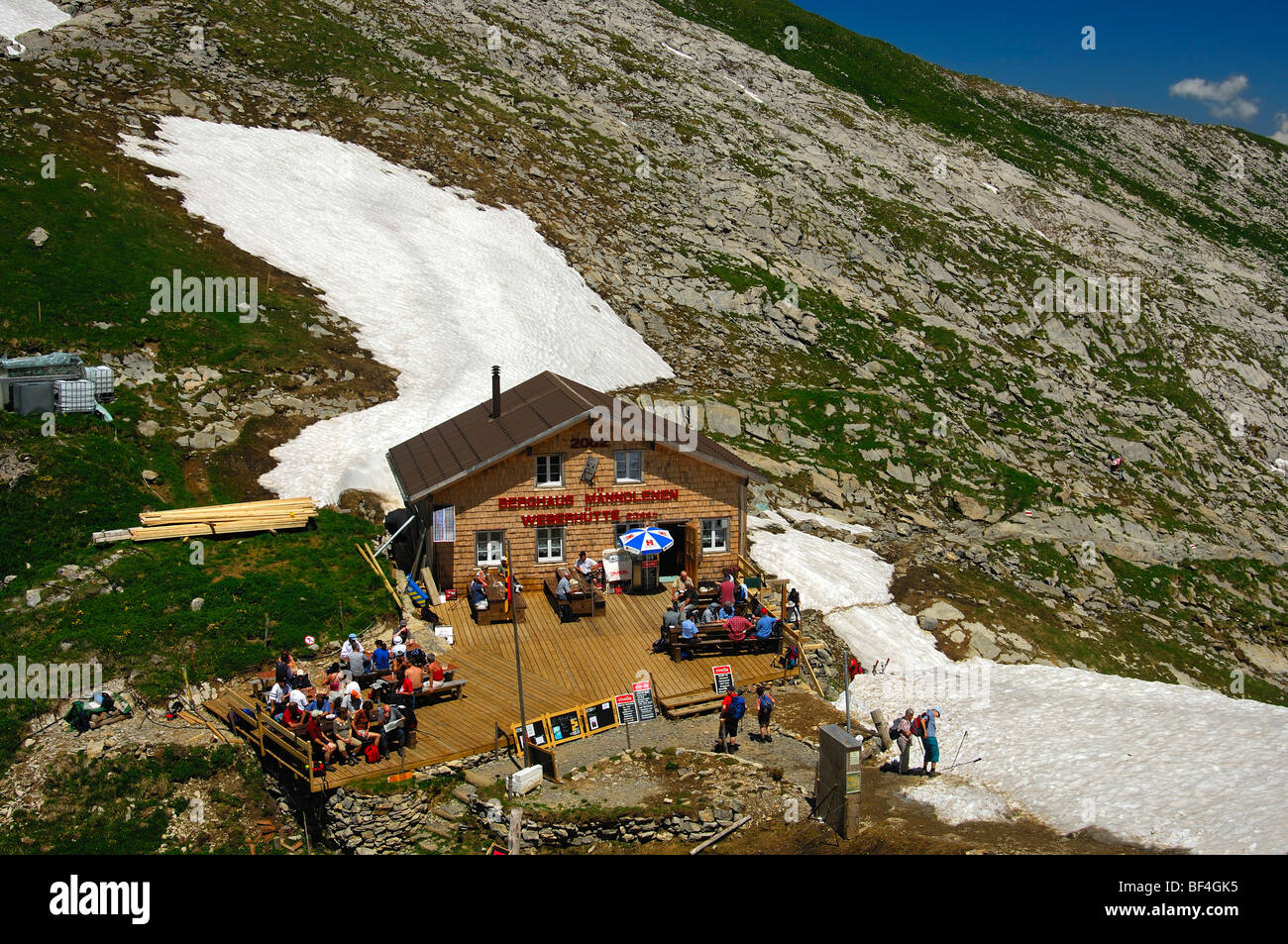 Mountain lodge Maenndlenen, Weber-Huette lodge, in a snowy field, Bernese Oberland, Switzerland, Europe Stock Photo