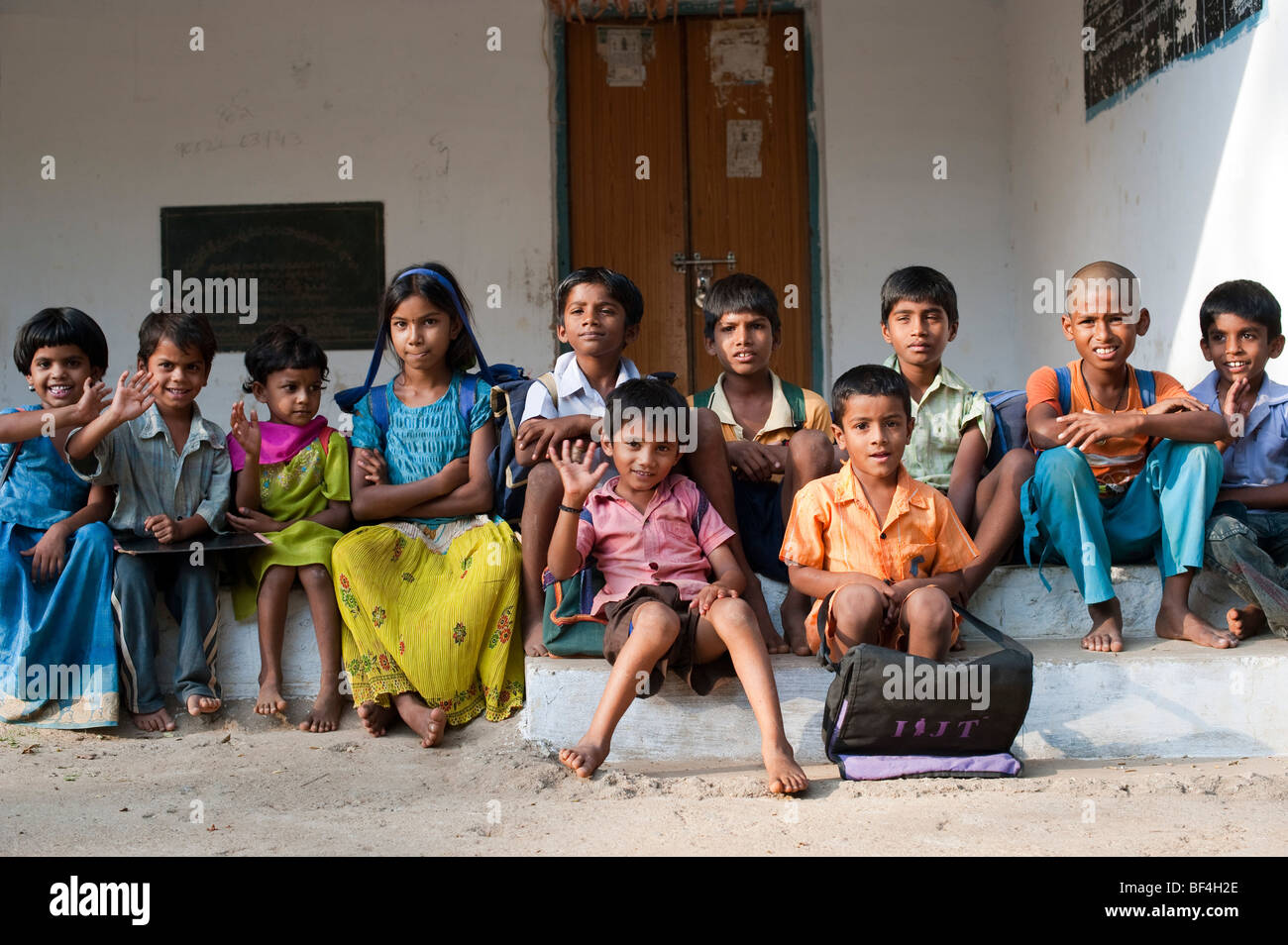 Indian school children sitting outside their rural village school. Andhra Pradesh, India Stock Photo