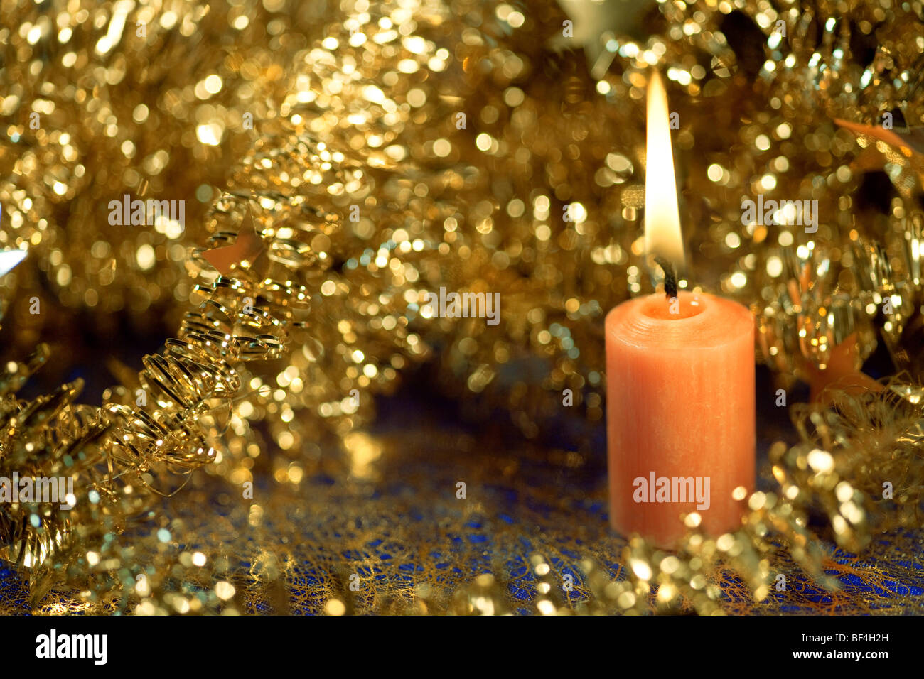 Christmas decorations with a burning candle Stock Photo