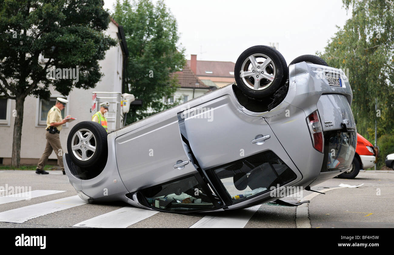 Daihatsu car having rolled over in a traffic accident, lying on its roof, Stuttgart, Baden-Wuerttemberg, Germany, Europe Stock Photo