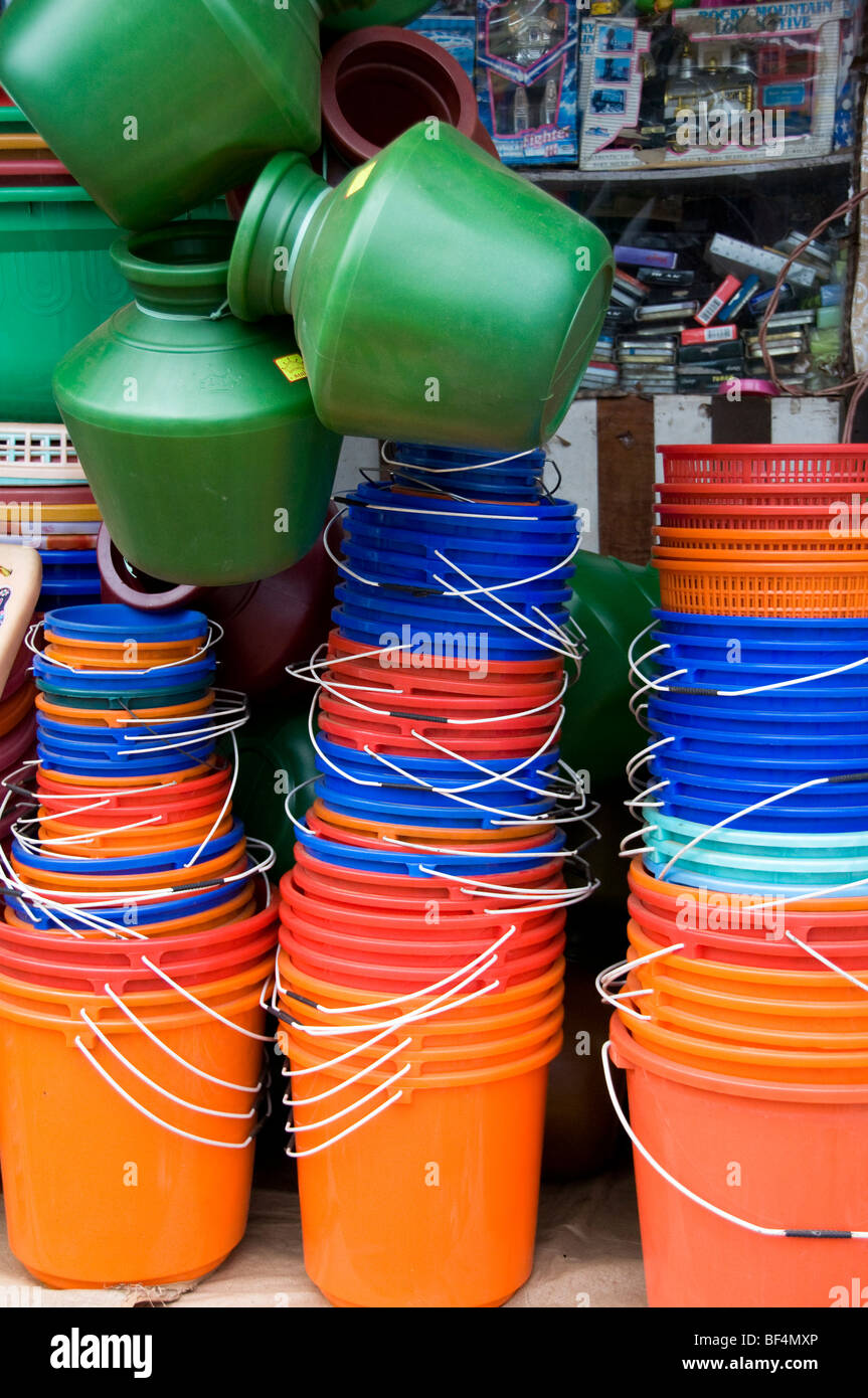 Colourful stack of plastic buckets and water containers on display outside a shop  Fort Cochin, (Fort Kochi)  Kerala, India Stock Photo