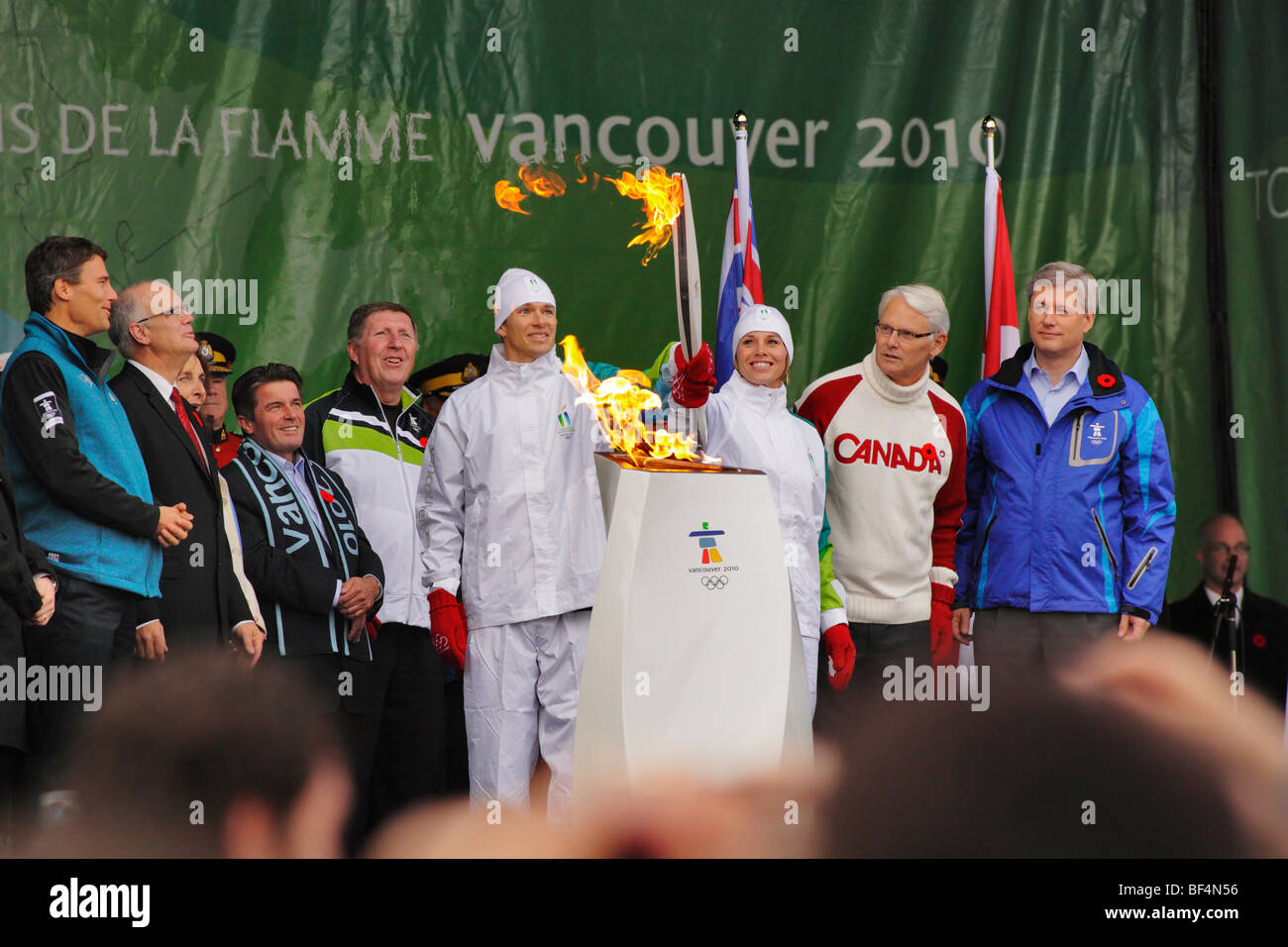 First relay team with the freshly lit 2010 Winter Olympic torch-Victoria, British Columbia, Canada. Stock Photo