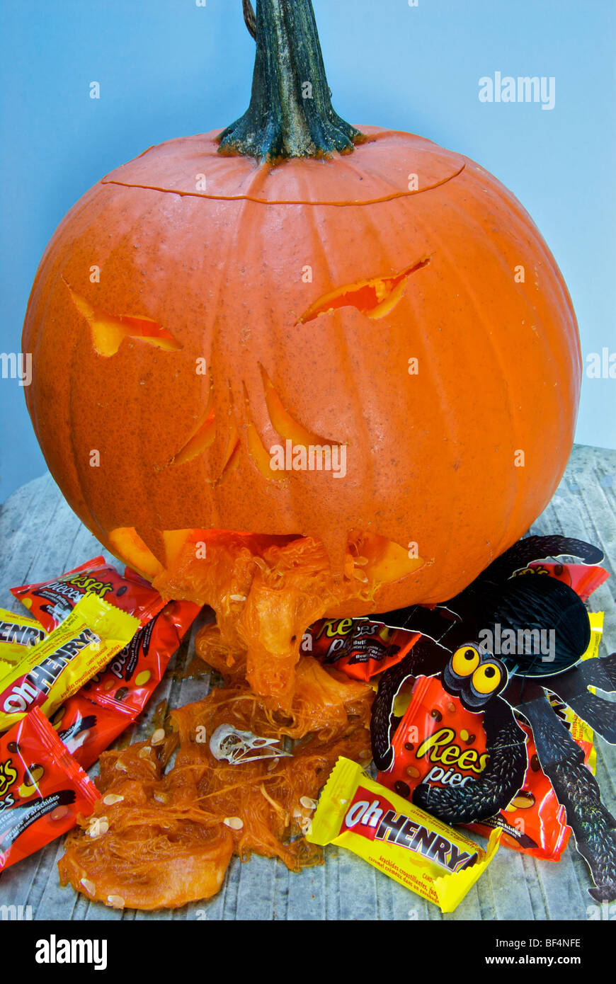 Jack o lantern hurling Halloween trick or treat candies Stock Photo
