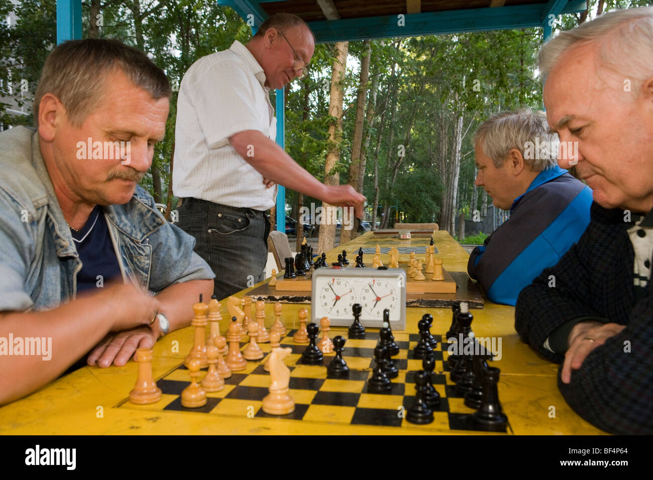 Russian men playing chess in park,  Ekaterinburg Russia Stock Photo