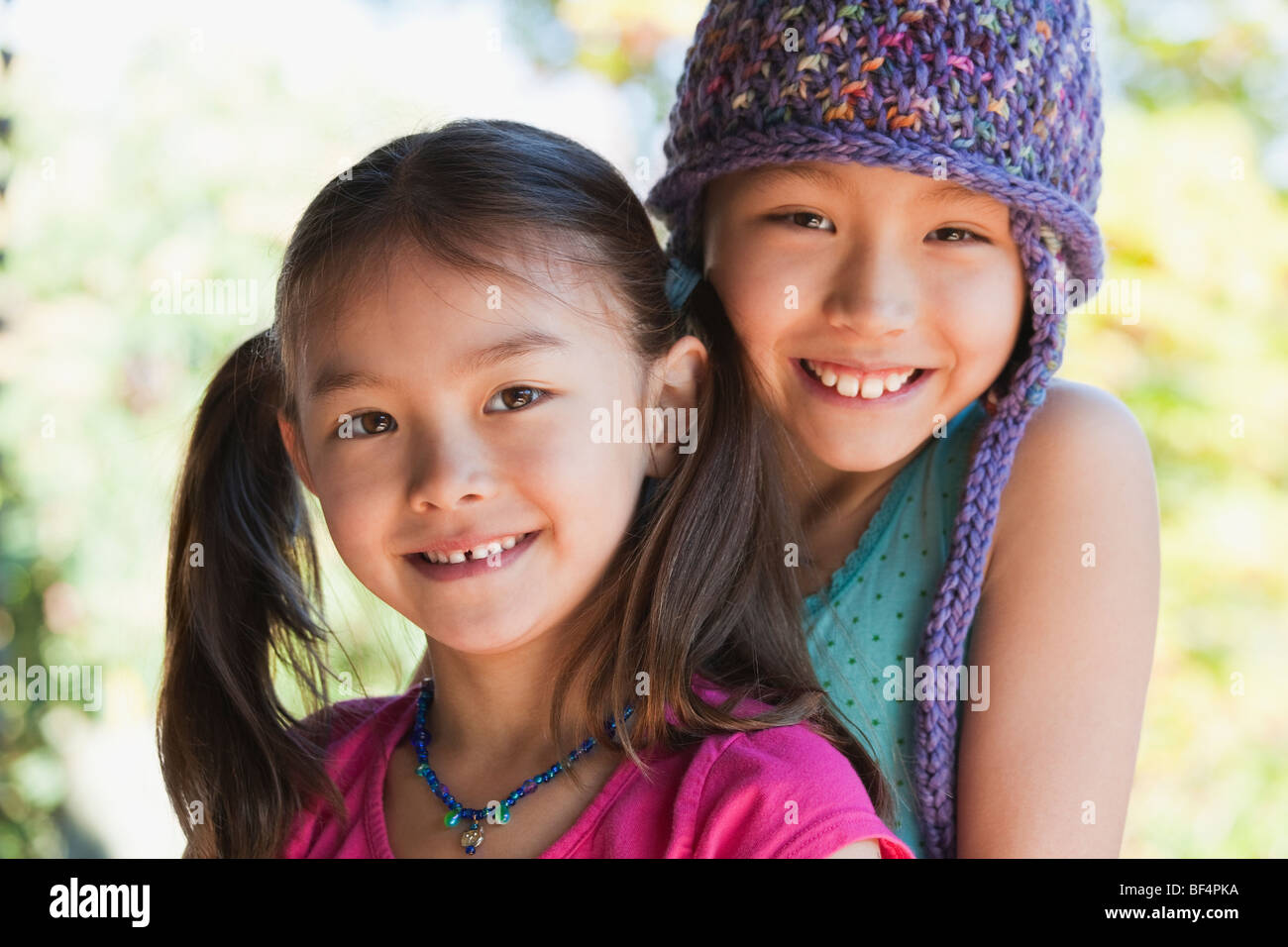 Girls hugging and smiling Stock Photo