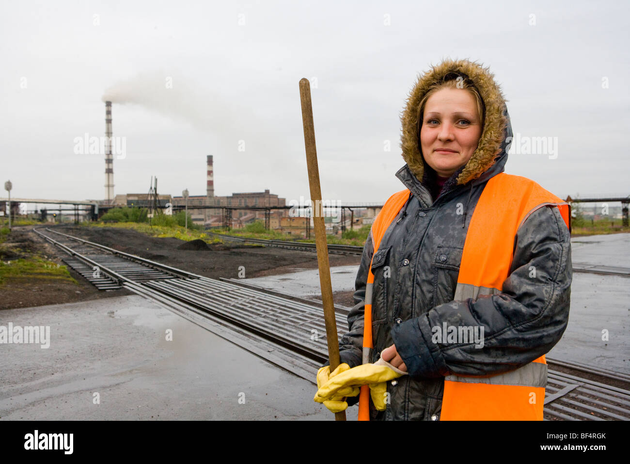 Woman railway worker on coal mine railway track, portrait, Vorkuta, Komi Republic, Arctic Russia Stock Photo