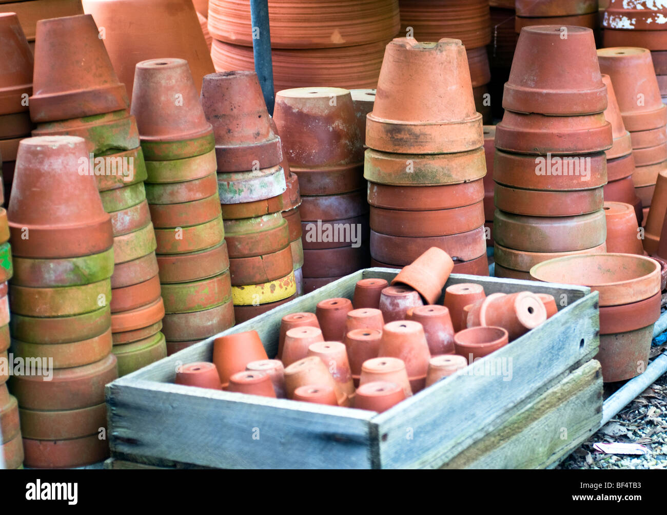 Terracotta flower pots without plants stacked in rows Stock Photo Alamy