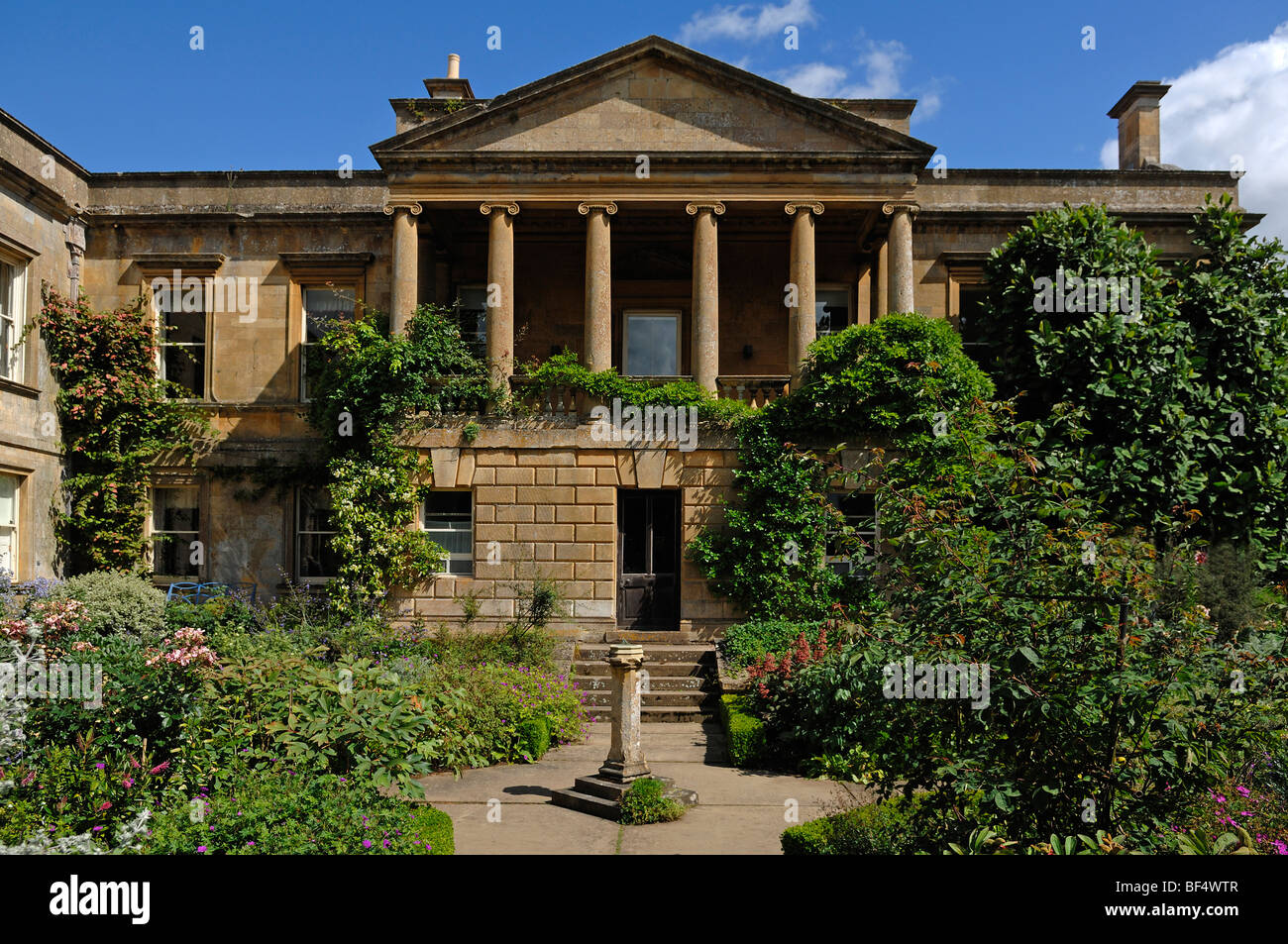 Garden and building with columns at Kiftsgate Court Gardens, late 19th Century, Mickleton, Chipping Campden, Gloucestershire, E Stock Photo