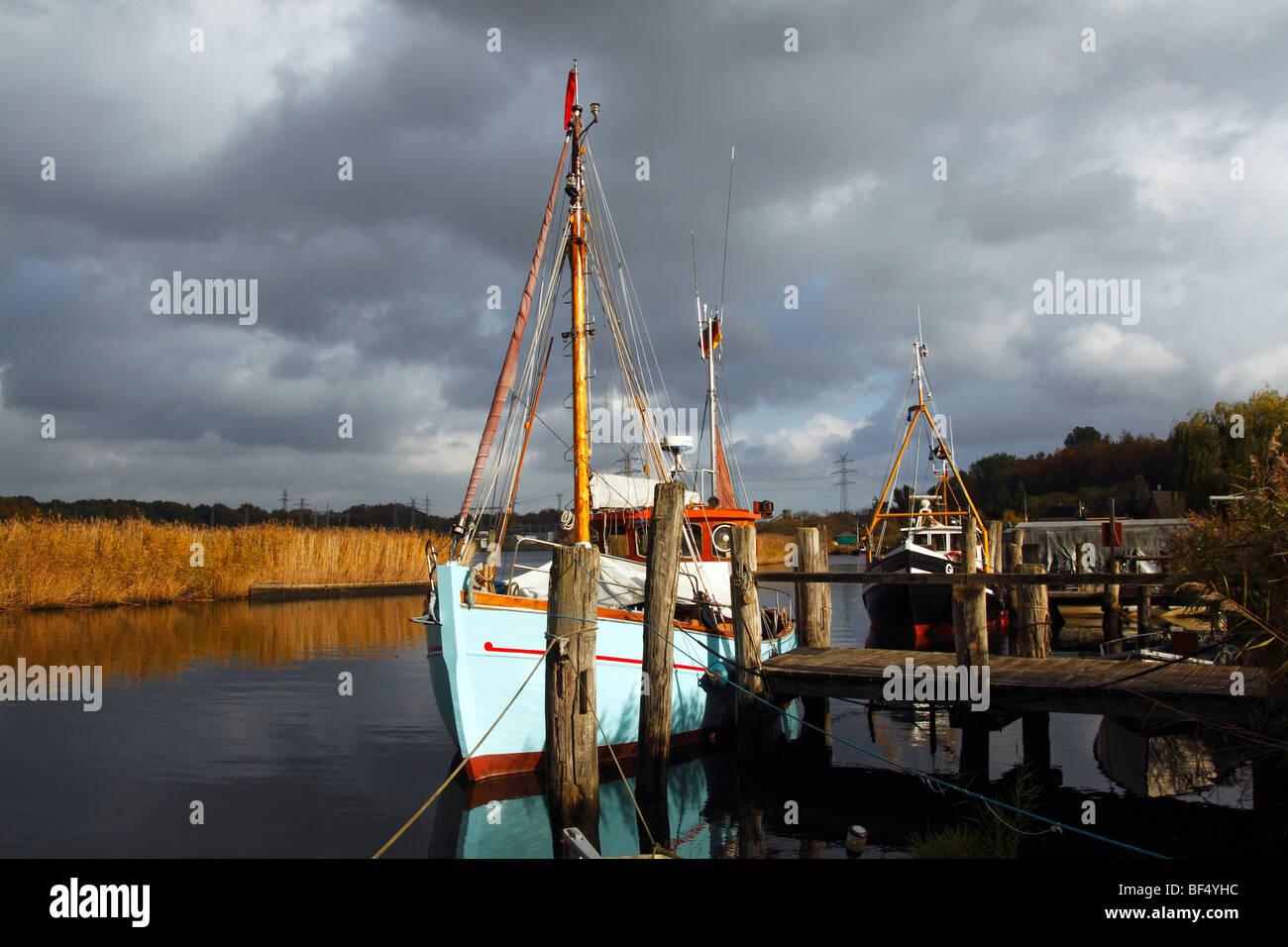 Fishing boats in the little harbour of Gothmund at the Trave river, hanseatic city of Luebeck, Schleswig-Holstein, Germany, Eur Stock Photo
