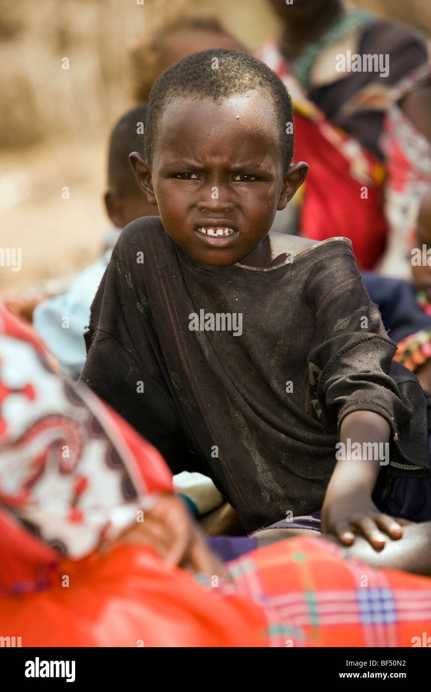 Maasai Child - Maasai Village near Masai Mara National Reserve, Kenya Stock Photo