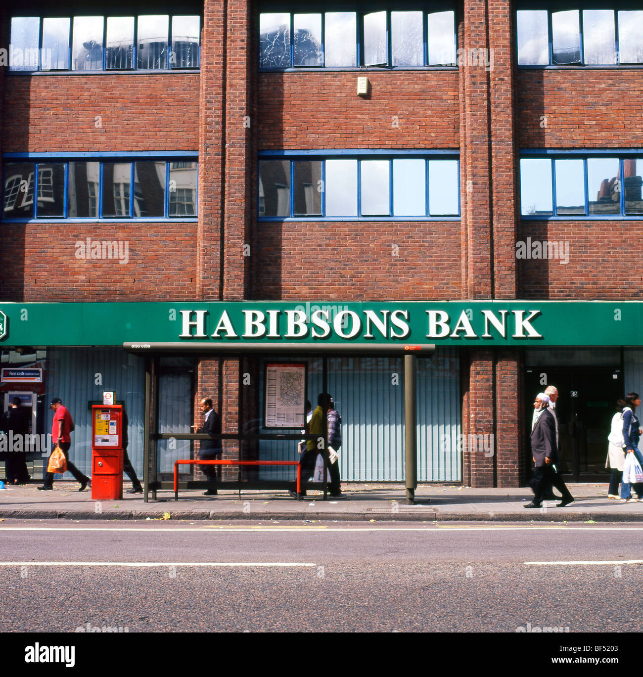 Pedestrians On Whitechapel High Street Walking Past Habibsons