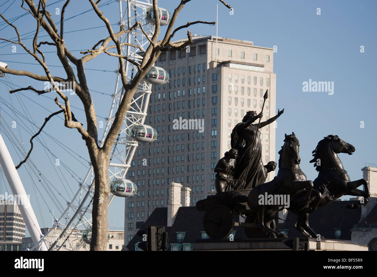 Statue of Boudica on Westminster Bridge, London with Shell Centre and the iconic London Eye in background Stock Photo